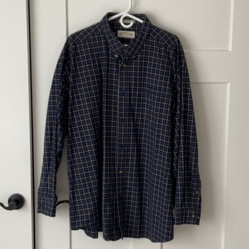 Long sleeved men’s Orvis button down shirt. Dark blue plaid.  Dress up or casual